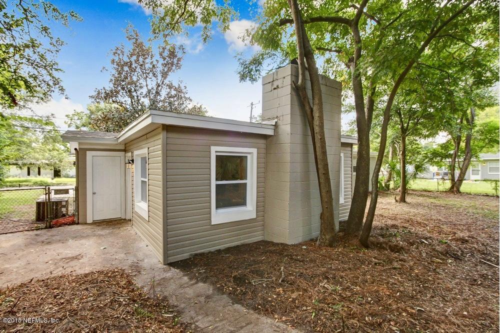 6815 Heidi Road Jacksonville, FL 32277 - Photo 32 of 36 a view of a house with a yard
