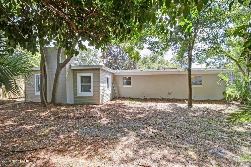 6815 Heidi Road Jacksonville, FL 32277 - Photo 33 of 36 a house with trees in front of it