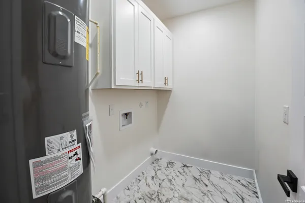 a view of storage and utility room with racks on the wall