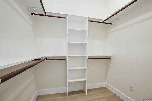 a view of an empty walk in closet