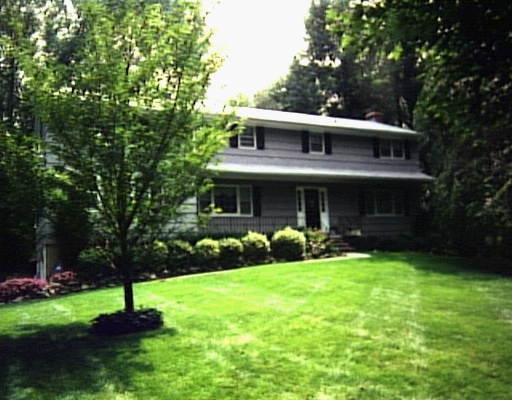 52 Remington Road Ridgefield, CT 06877 - Photo 1 of 1 a front view of a house with a yard