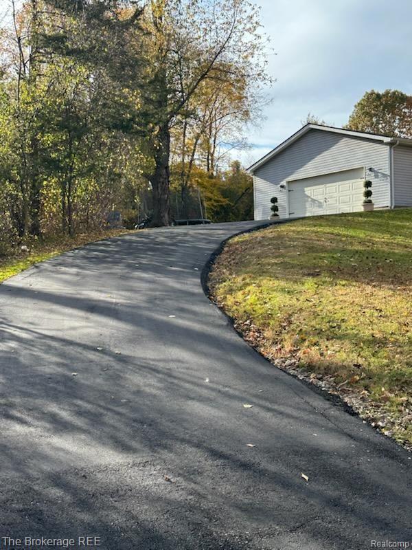 1245 Hill Road White Lake, MI 48383 - Photo 4 of 21 Please note the angle of the driveway
