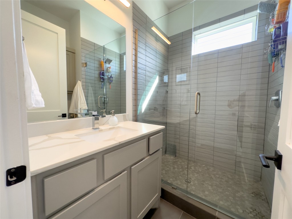 2804 South 1st Street, Unit 1301 Austin, TX 78704 - Photo 14 of 15 a bathroom with a sink and a mirror