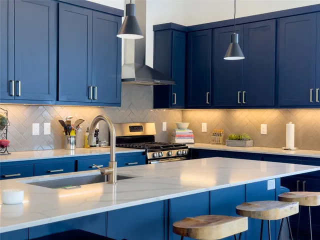 a kitchen with a sink and cabinets