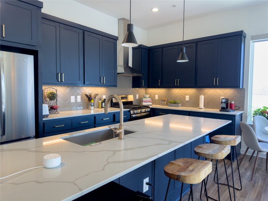 2804 South 1st Street, Unit 1301 Austin, TX 78704 - Photo 3 of 15 a kitchen with a sink cabinets and window