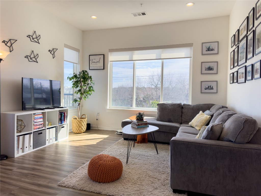 2804 South 1st Street, Unit 1301 Austin, TX 78704 - Photo 4 of 15 a living room with furniture and a flat screen tv