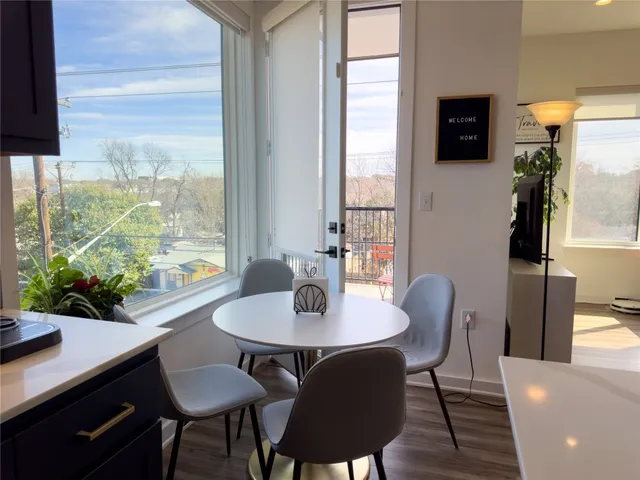 a view of a dining room with furniture window and outside view