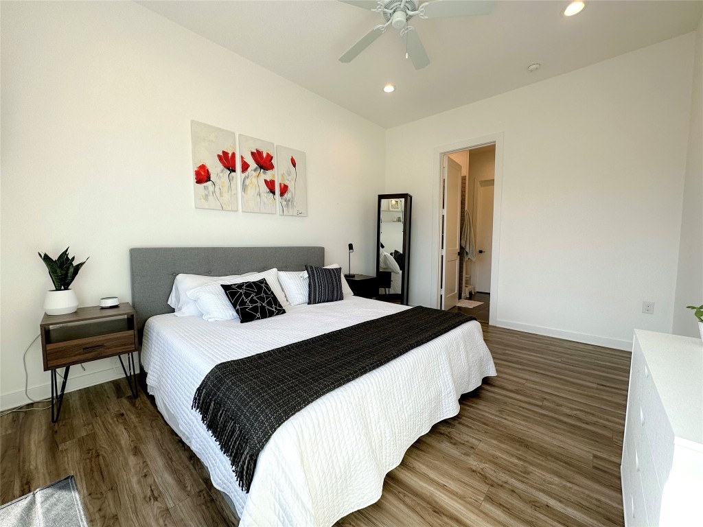 2804 South 1st Street, Unit 1301 Austin, TX 78704 - Photo 10 of 15 a bedroom with bed and wooden floor