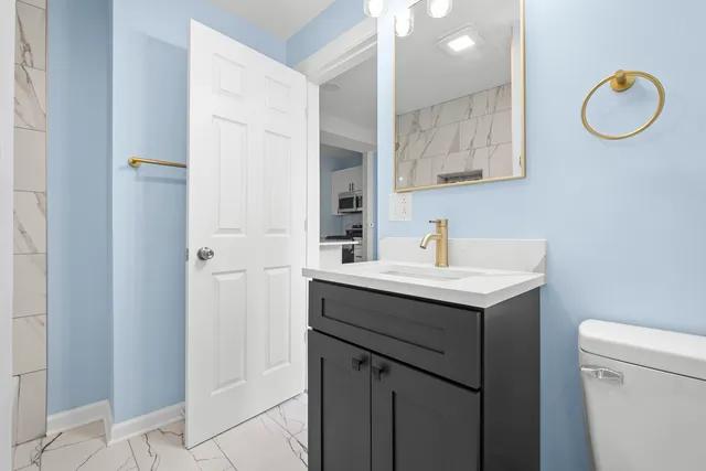 a bathroom with a sink and a mirror