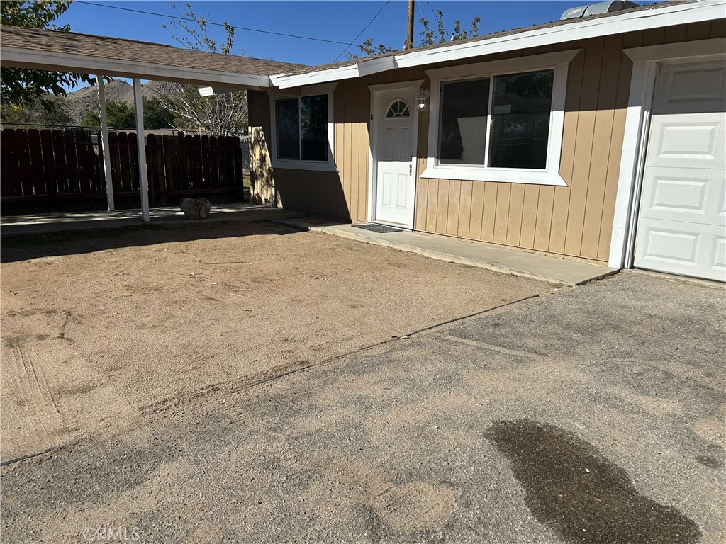 15784 Wanaque Road, Unit C Apple Valley, CA 92307 - Photo 2 of 9 a view of a house with a outdoor space