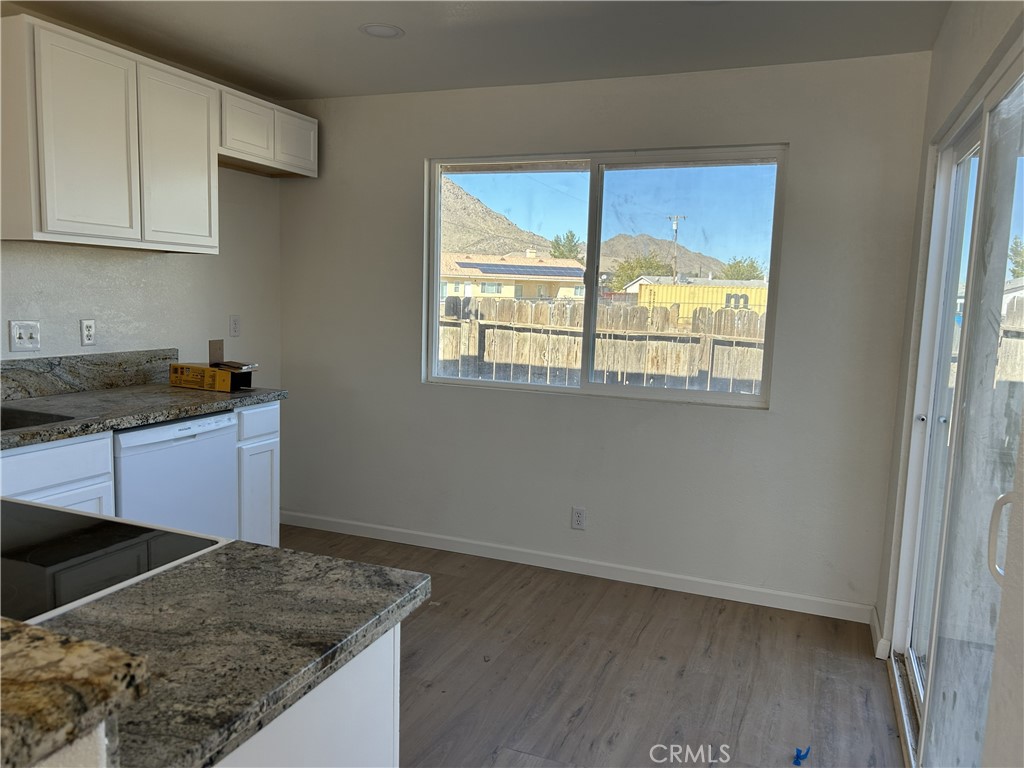 15784 Wanaque Road, Unit C Apple Valley, CA 92307 - Photo 6 of 9 a kitchen that has a sink and a stove