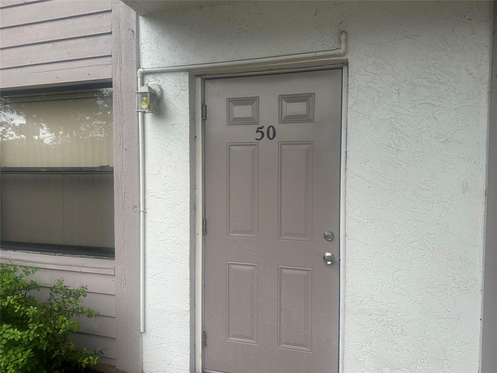 11150 West Sample Road, Unit 50 Coral Springs, FL 33065 - Photo 11 of 11 a view of a wooden door