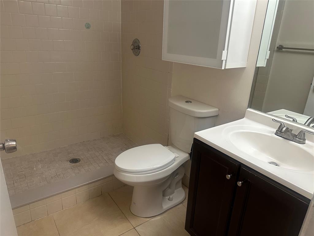 11150 West Sample Road, Unit 50 Coral Springs, FL 33065 - Photo 6 of 11 a bathroom with a sink toilet and shower
