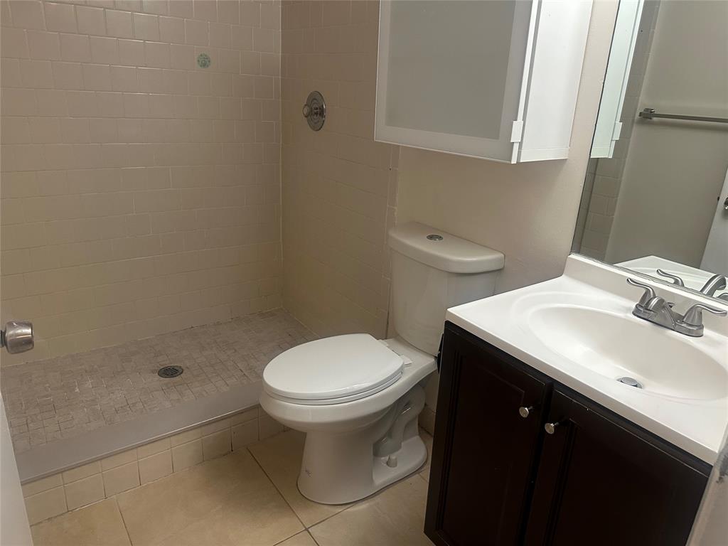 11150 West Sample Road, Unit 50 Coral Springs, FL 33065 - Photo 7 of 11 a bathroom with a sink toilet and shower