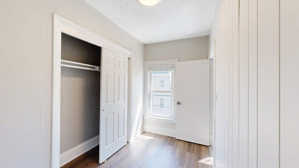 44 Morris Street, Unit 2 Boston, MA 02128 - Photo 11 of 23 a view of empty room with wooden floor