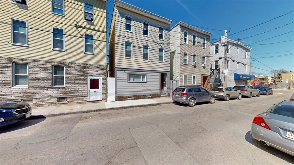 44 Morris Street, Unit 2 Boston, MA 02128 - Photo 13 of 23 a car parked in front of a building