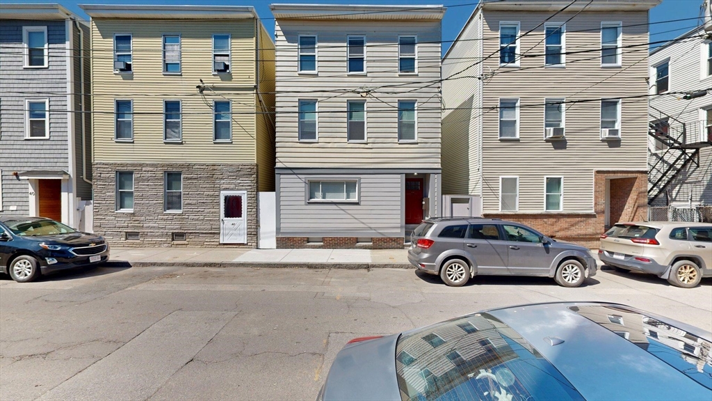 44 Morris Street, Unit 2 Boston, MA 02128 - Photo 14 of 23 a car parked in front of a building