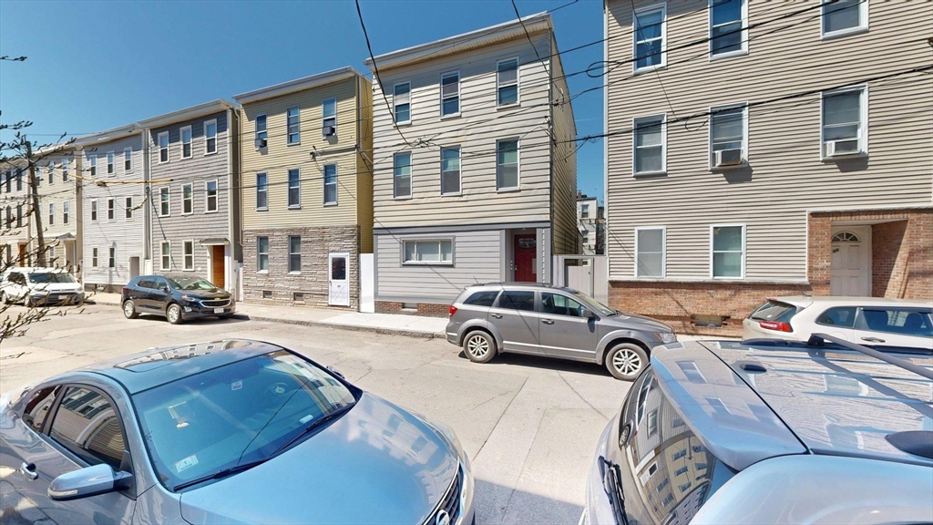 44 Morris Street, Unit 2 Boston, MA 02128 - Photo 15 of 23 a car parked in front of a building