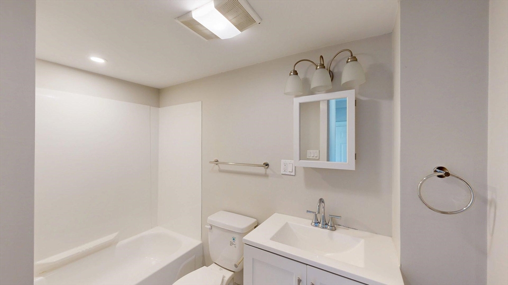44 Morris Street, Unit 2 Boston, MA 02128 - Photo 5 of 23 a bathroom with a sink a toilet and shower