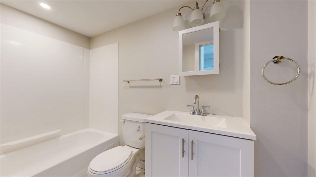 44 Morris Street, Unit 2 Boston, MA 02128 - Photo 6 of 23 a bathroom with a sink toilet and shower