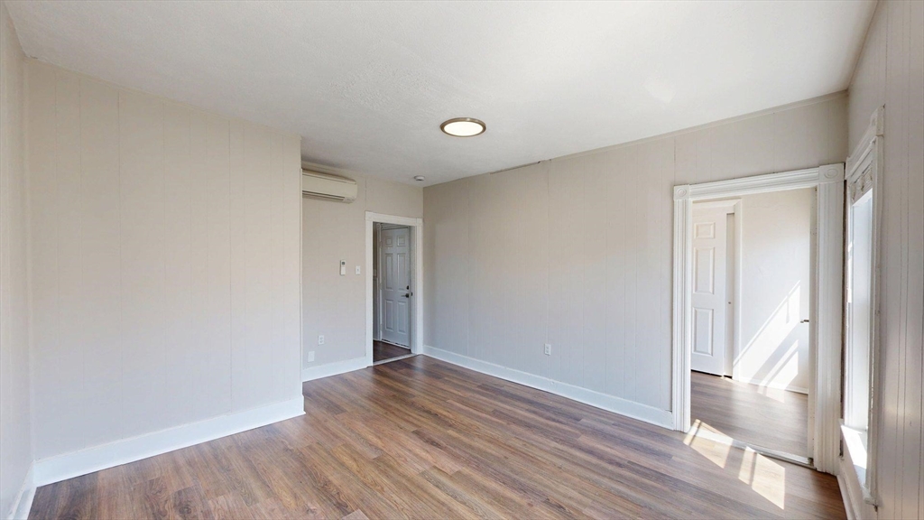 44 Morris Street, Unit 2 Boston, MA 02128 - Photo 8 of 23 a view of an empty room with wooden floor