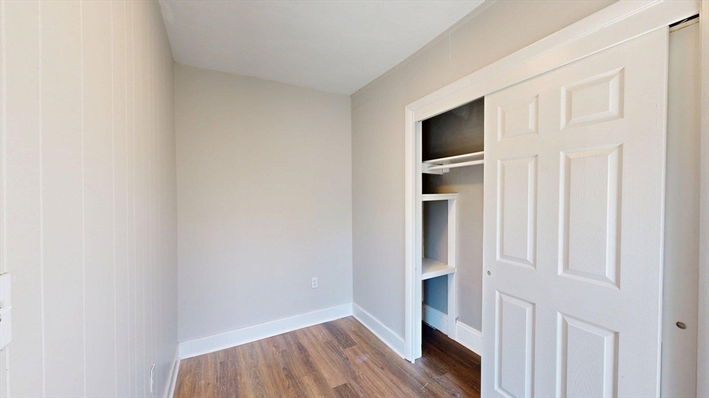 44 Morris Street, Unit 2 Boston, MA 02128 - Photo 10 of 23 a view of an empty room with wooden floor and closet