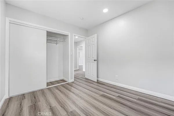 a view of wooden floor in an empty room