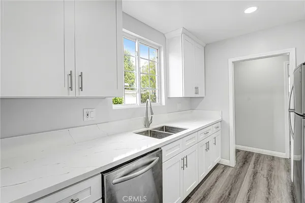 a kitchen with a sink and cabinets