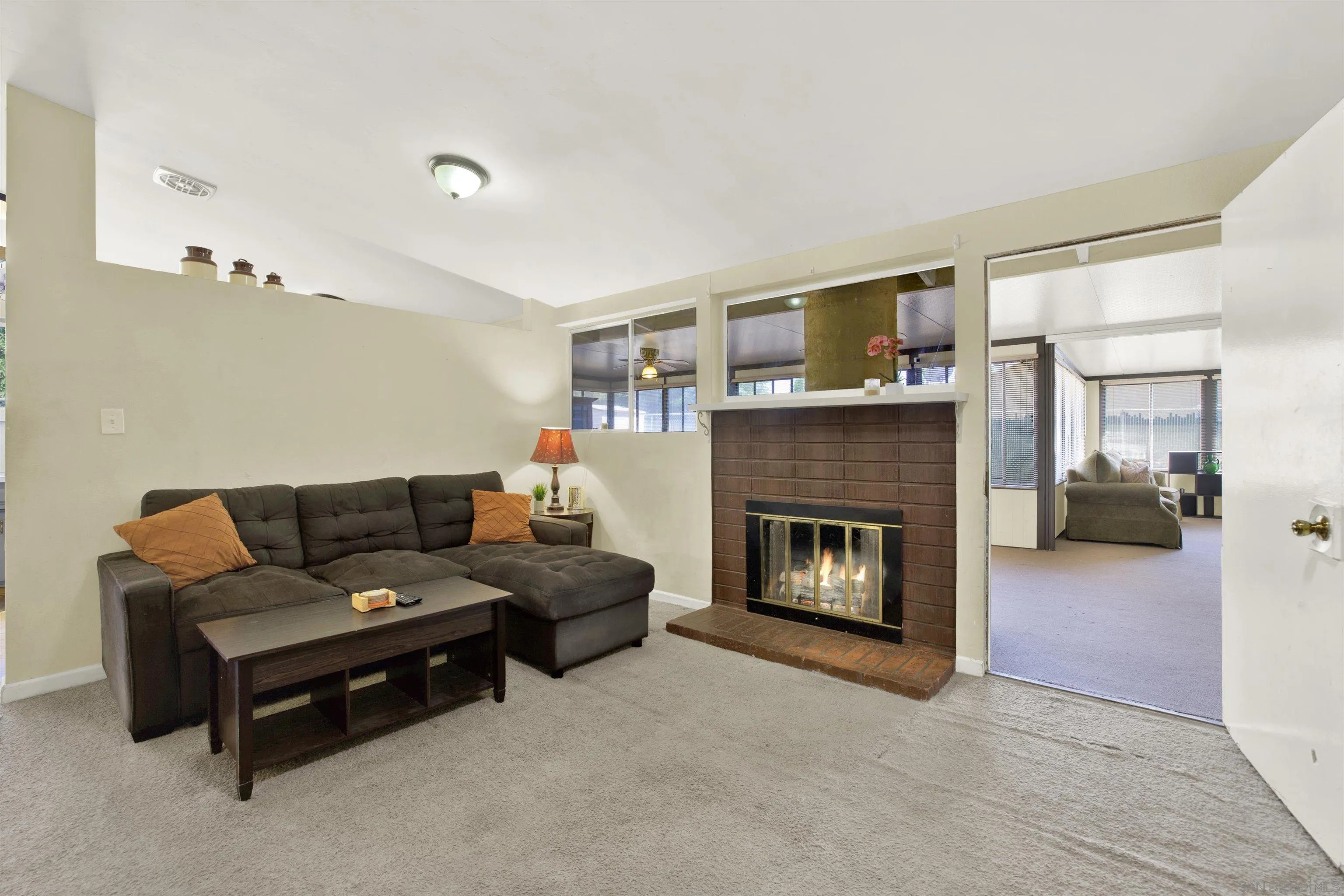 13951 Powers Road Poway, CA 92064 - Photo 11 of 27 a living room with furniture and a fireplace