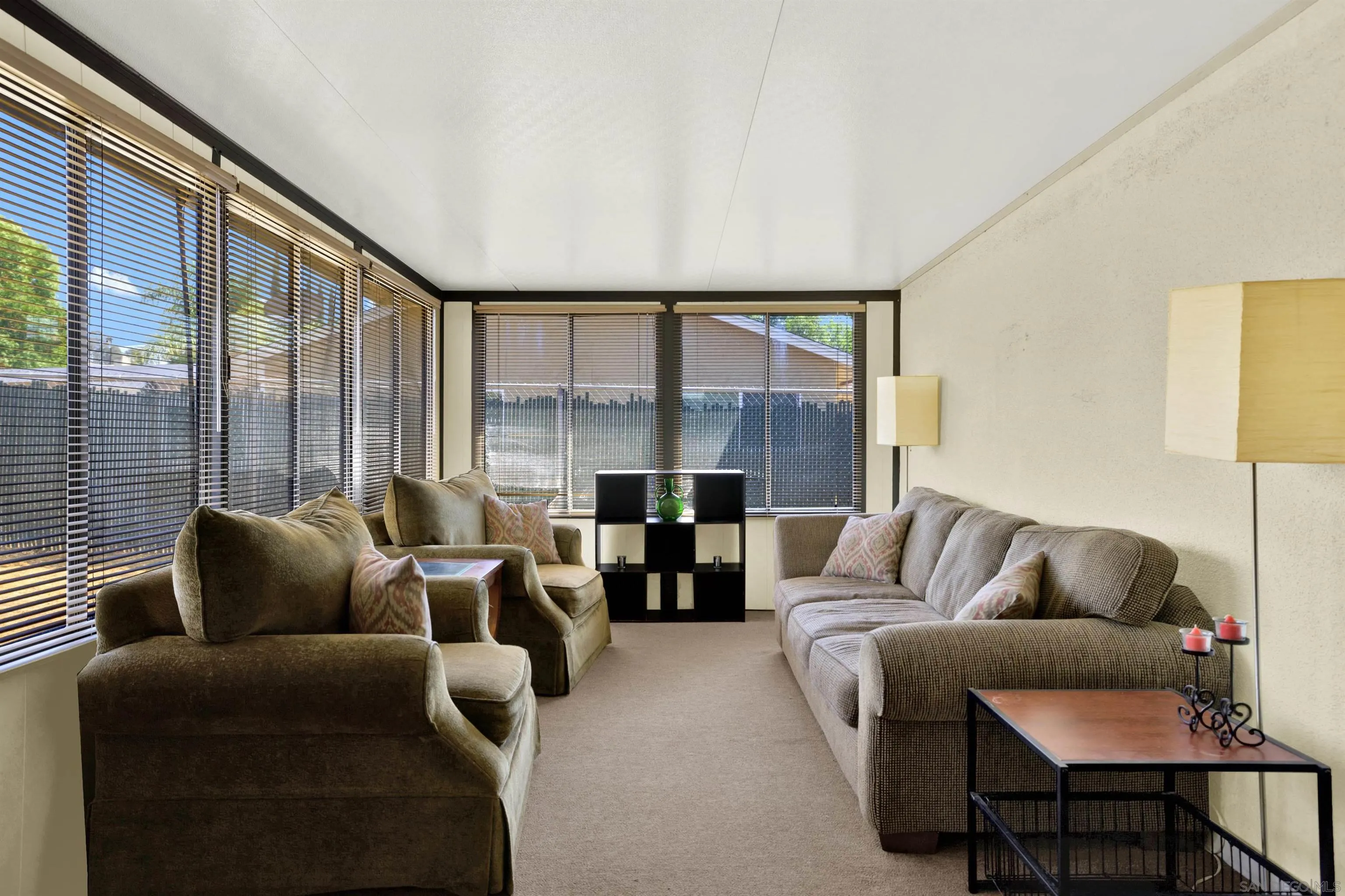 13951 Powers Road Poway, CA 92064 - Photo 15 of 27 a living room with furniture and a large window