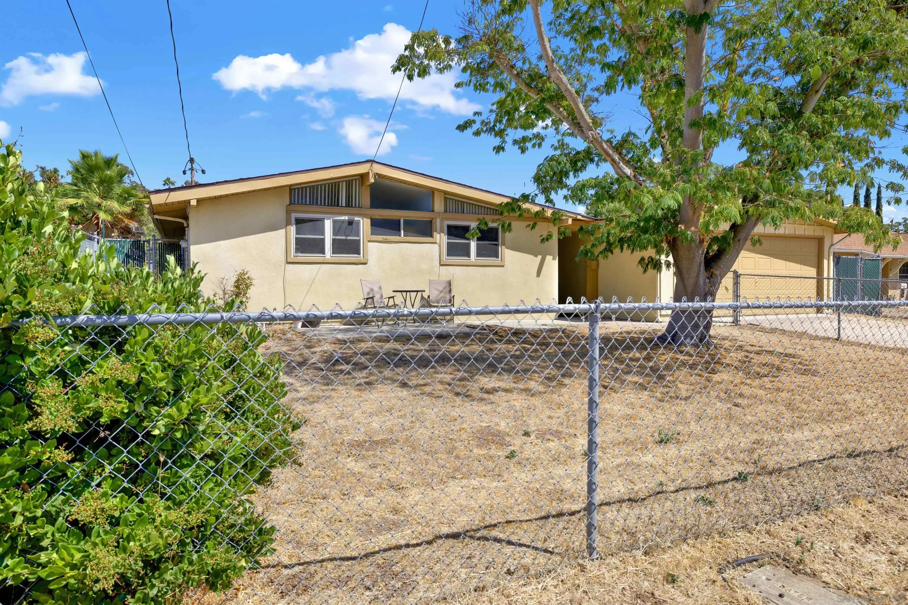 13951 Powers Road Poway, CA 92064 - Photo 2 of 27 a front view of a house with a yard