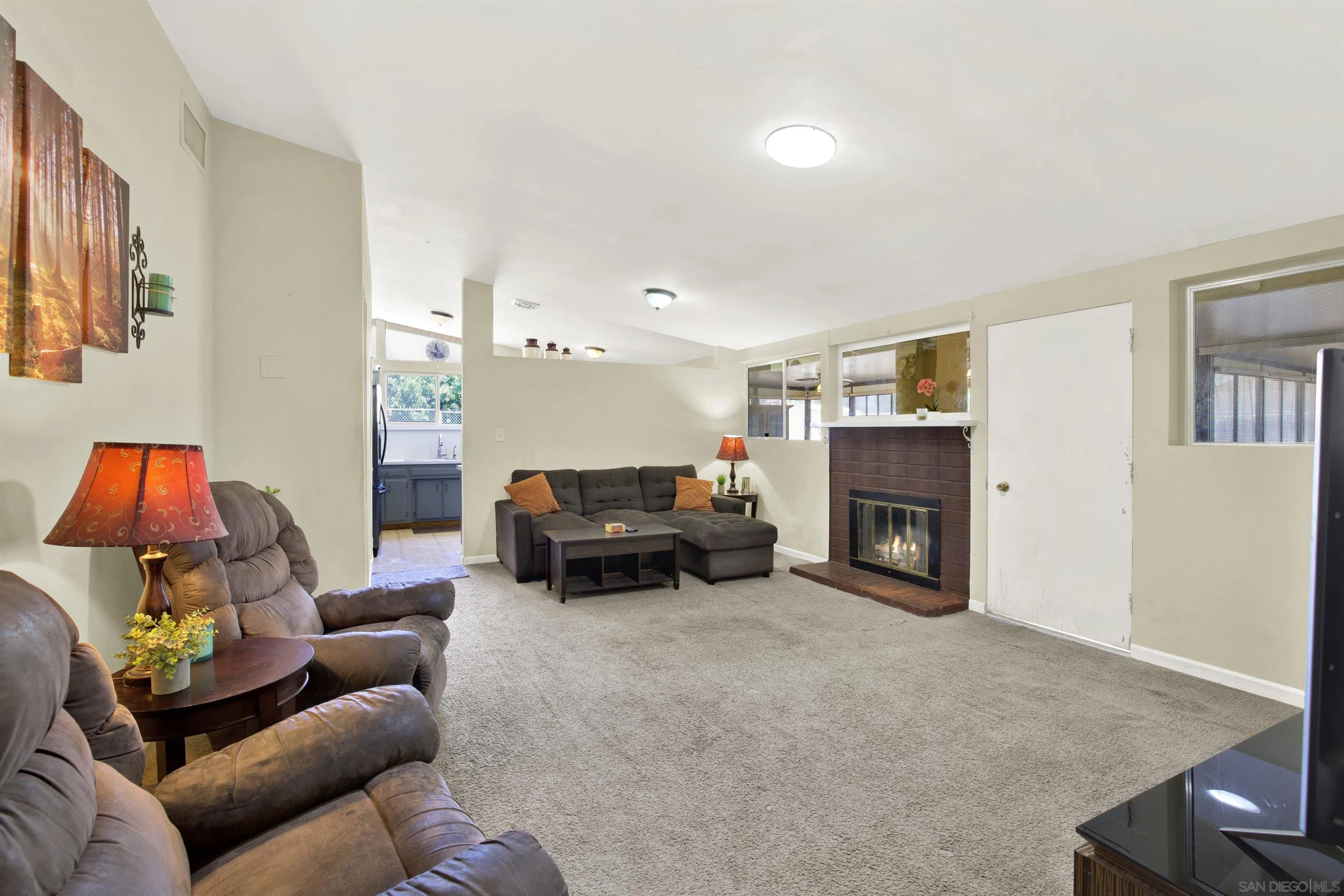 13951 Powers Road Poway, CA 92064 - Photo 9 of 27 a living room with furniture and a fireplace