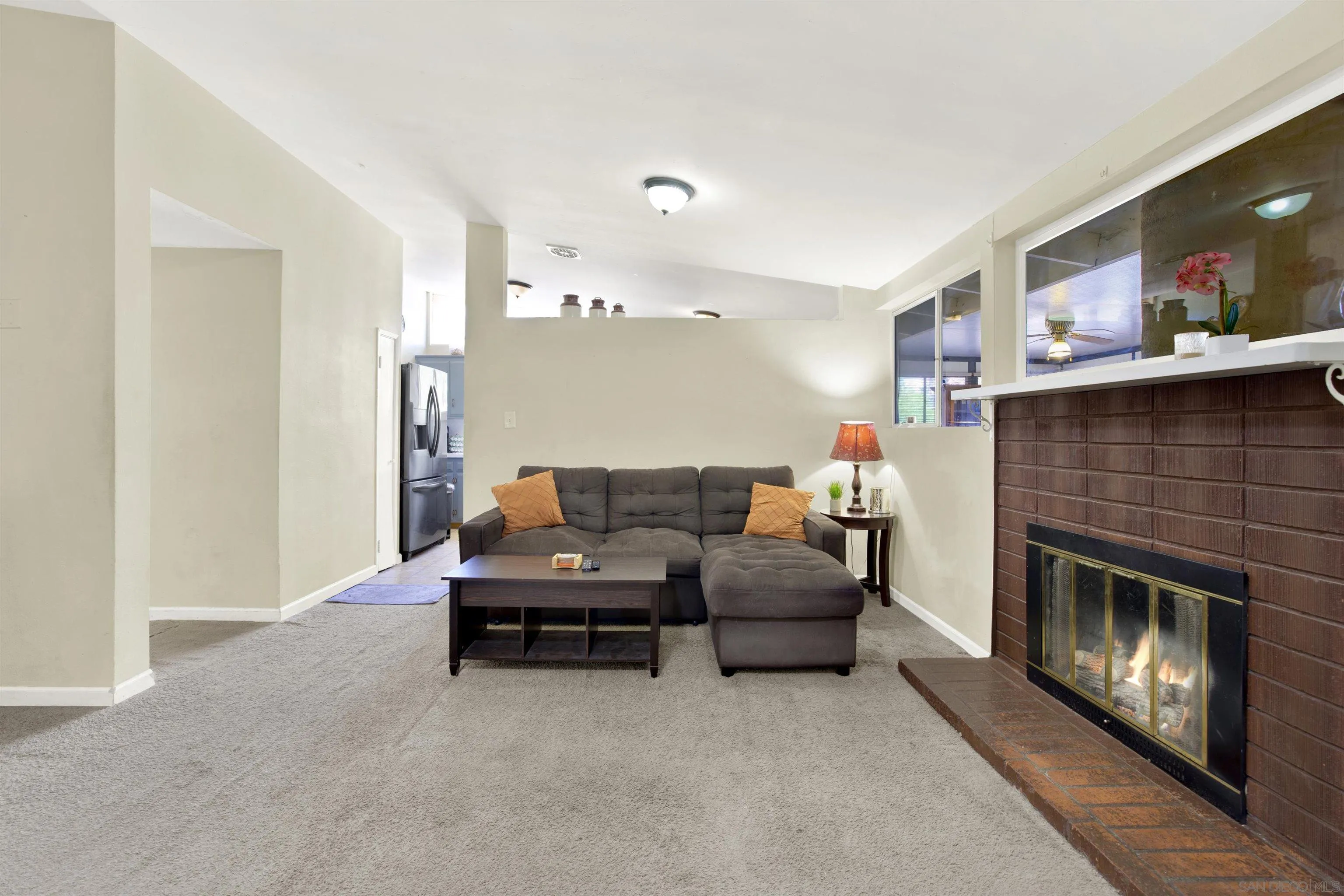 13951 Powers Road Poway, CA 92064 - Photo 10 of 27 a living room with furniture and a fireplace