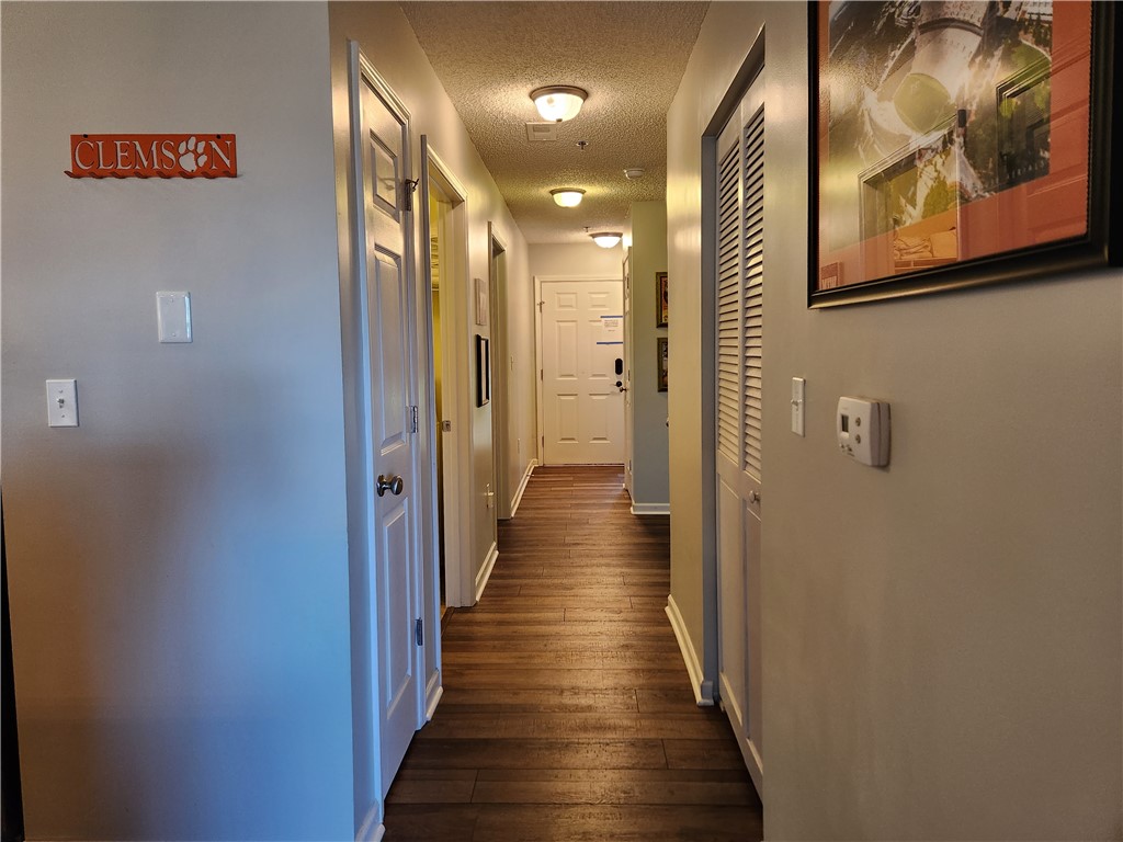 312 Killdevil Hill, Unit A Six Mile, SC 29682 - Photo 20 of 44 Hallway leads to two bedrooms with walk-in closets