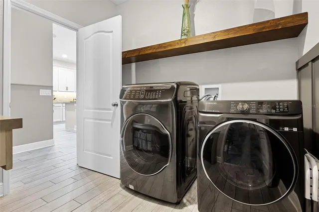 a utility room with dryer and washer