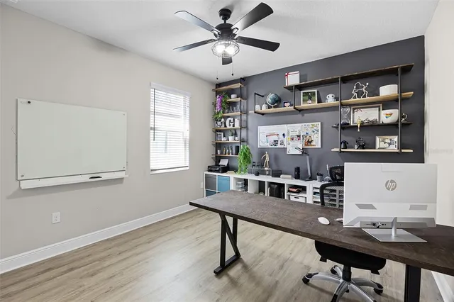 a workspace with furniture and window