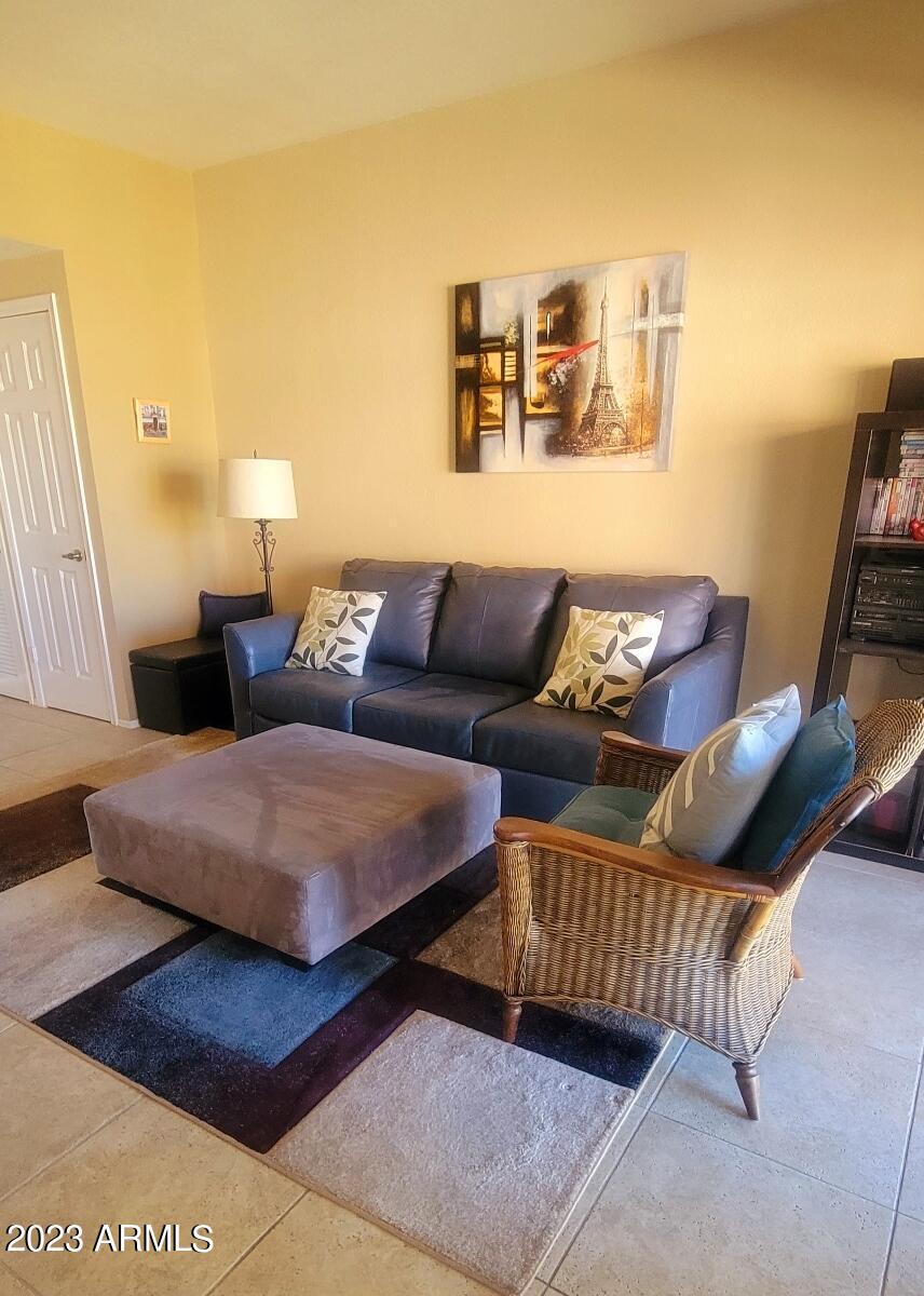 9711 East Mountain View Road, Unit 2500 Scottsdale, AZ 85258 - Photo 12 of 17 a living room with furniture and a couch