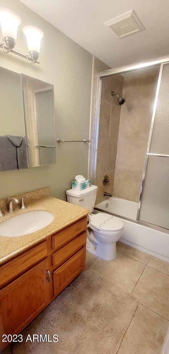 9711 East Mountain View Road, Unit 2500 Scottsdale, AZ 85258 - Photo 16 of 17 a bathroom with a sink a toilet and shower