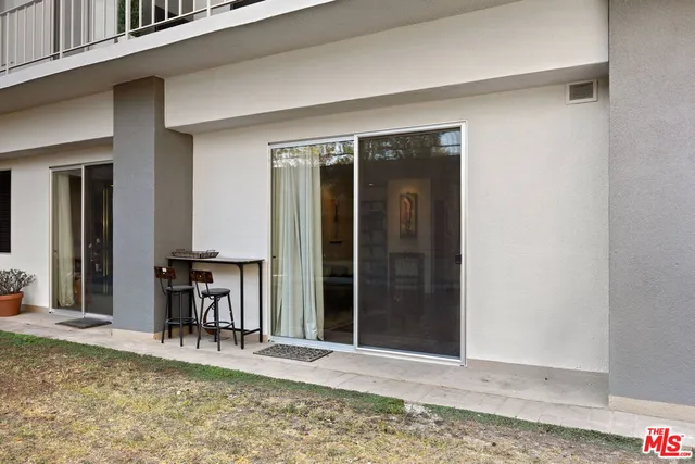 a view of a front door and a yard