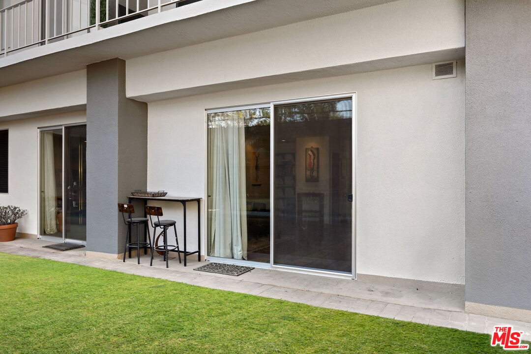 100 South Doheny Drive, Unit 214 Los Angeles, CA 90048 - Photo 11 of 17 a view of front door and yard with seating space
