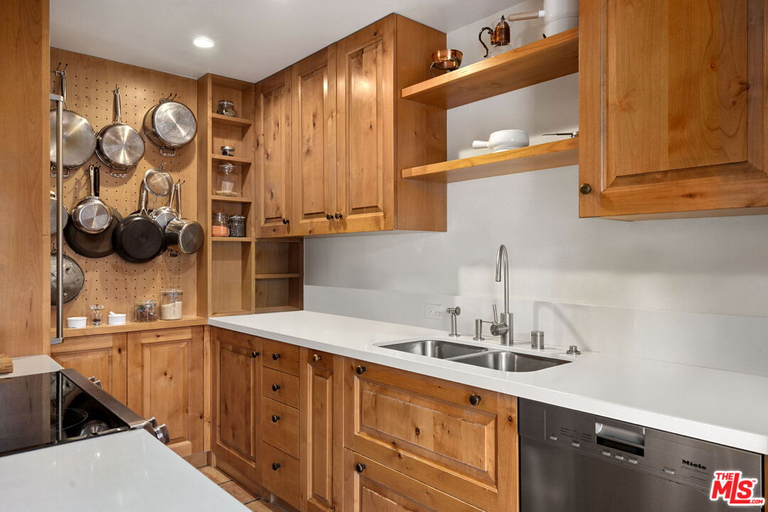 100 South Doheny Drive, Unit 214 Los Angeles, CA 90048 - Photo 2 of 17 a kitchen with a sink and cabinets