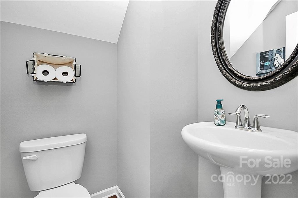 78134 Rillstone Drive Lancaster, SC 29720 - Photo 14 of 26 a bathroom with a toilet sink and mirror