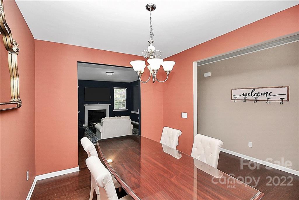 78134 Rillstone Drive Lancaster, SC 29720 - Photo 17 of 26 a dining room with furniture and wooden floor