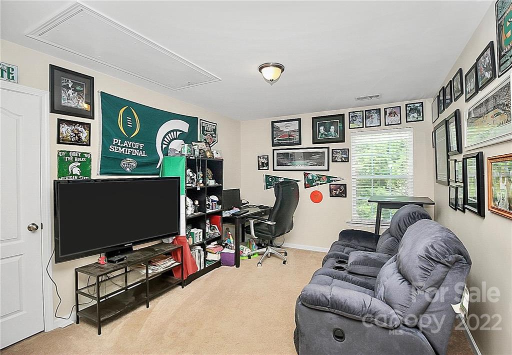 78134 Rillstone Drive Lancaster, SC 29720 - Photo 18 of 26 a living room with furniture and a flat screen tv