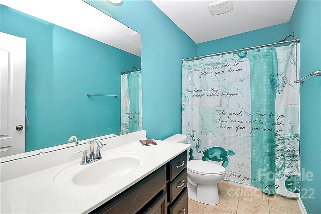78134 Rillstone Drive Lancaster, SC 29720 - Photo 19 of 26 a bathroom with a sink toilet and shower