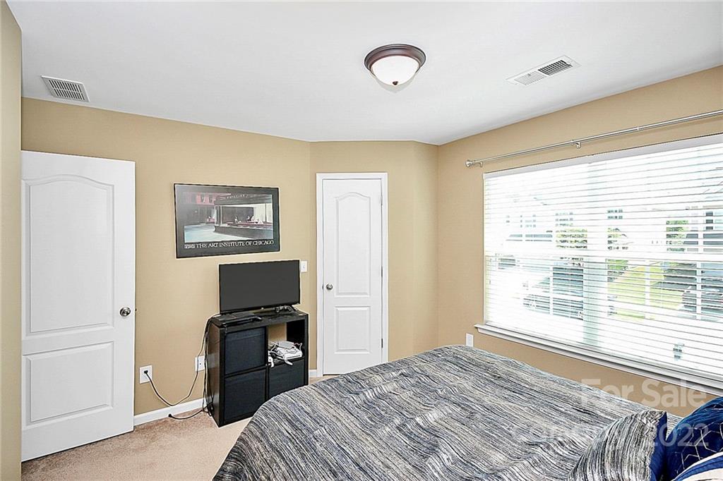 78134 Rillstone Drive Lancaster, SC 29720 - Photo 20 of 26 a bedroom with a bed and a window