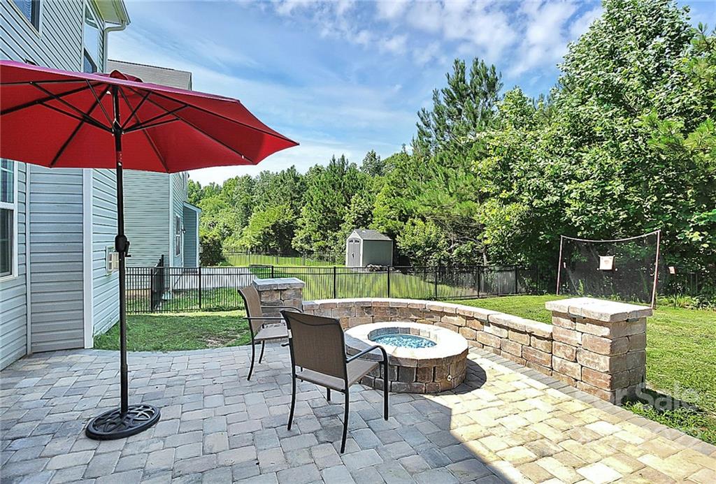 78134 Rillstone Drive Lancaster, SC 29720 - Photo 3 of 26 a patio with a table and chairs