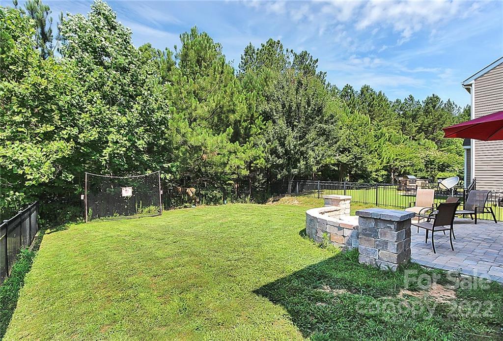 78134 Rillstone Drive Lancaster, SC 29720 - Photo 4 of 26 a backyard of a house with table and chairs