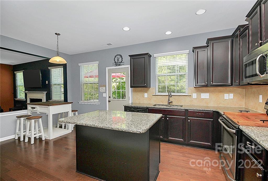 78134 Rillstone Drive Lancaster, SC 29720 - Photo 10 of 26 a kitchen with lots of counter top space a sink appliances and cabinets