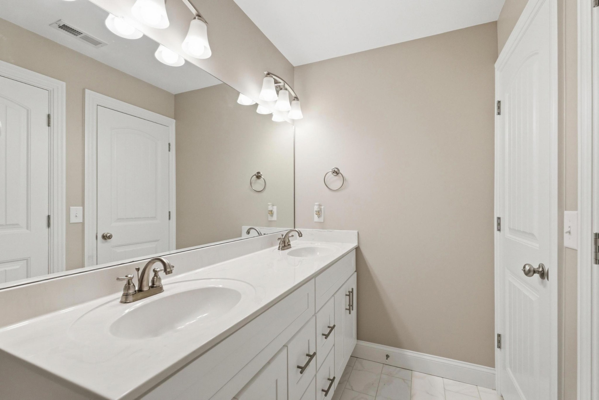6000 Wallaby Court Spring Hill, TN 37174 - Photo 36 of 57 a bathroom with a sink vanity and a mirror